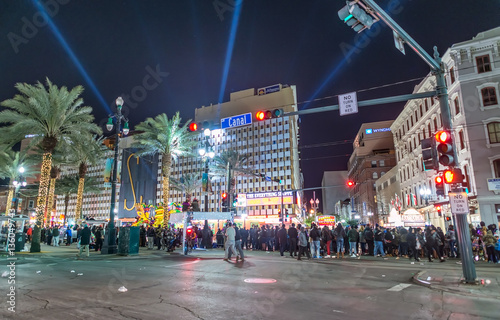 NEW ORLEANS - FEBRUARY 8, 2016: Tourists along city streets at n photo