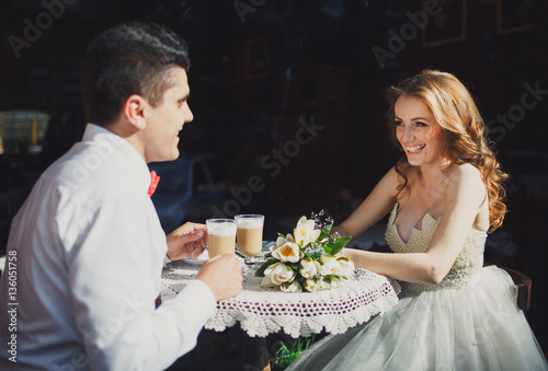 The lovely couple in love sits in restaurant