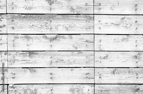 Old wooden planks texture with weathered white paint
