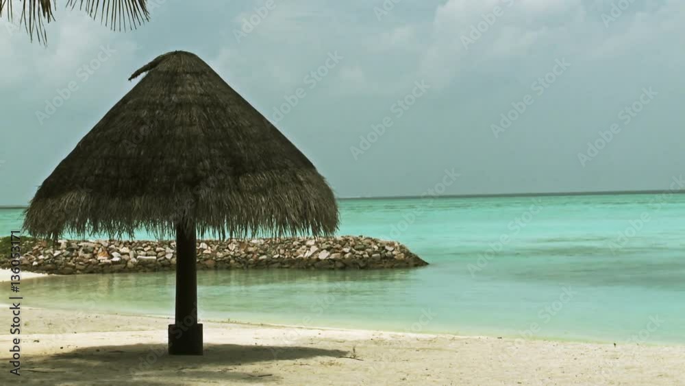 Maldives luxury island. Palm shelter at the beach. Maldives luxury island. Palm shelter at the beach.