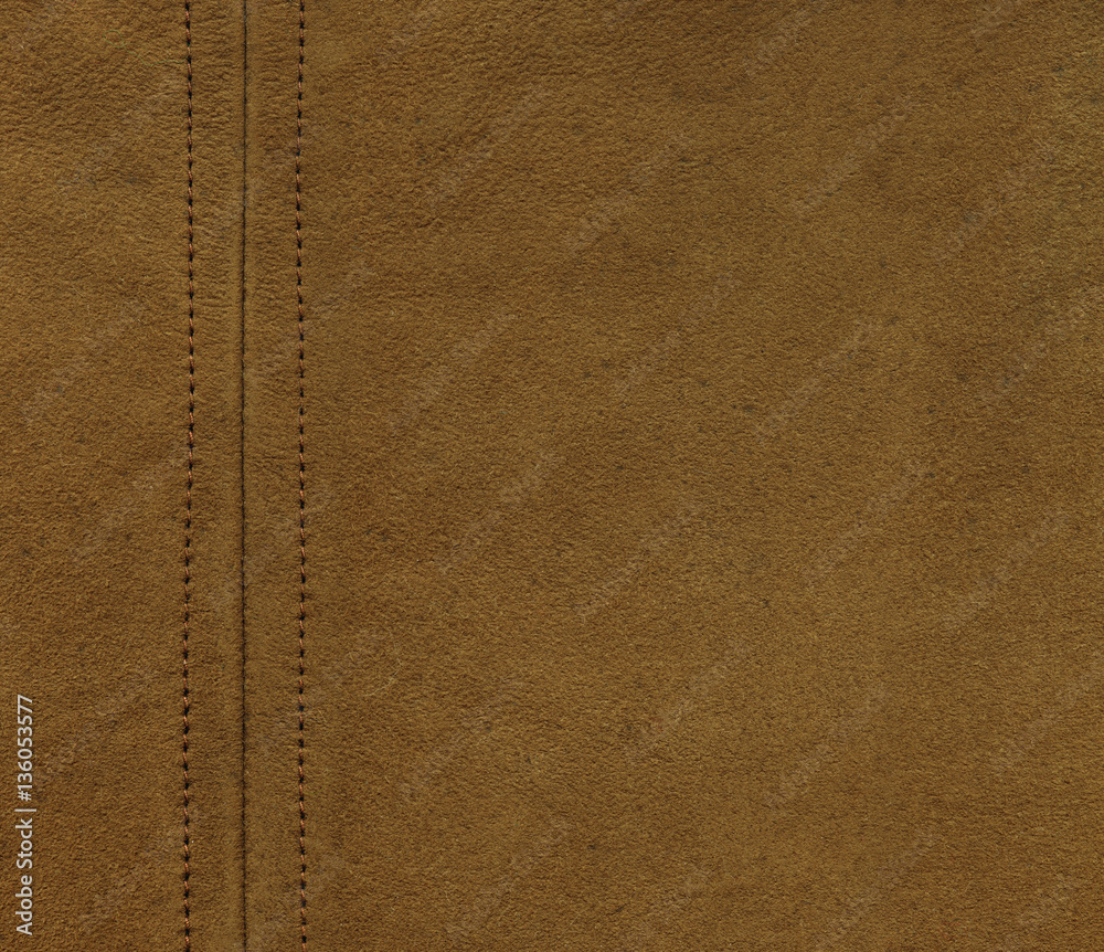 Texture of brown leather with a straight seam Texture of brown leather with a straight seam