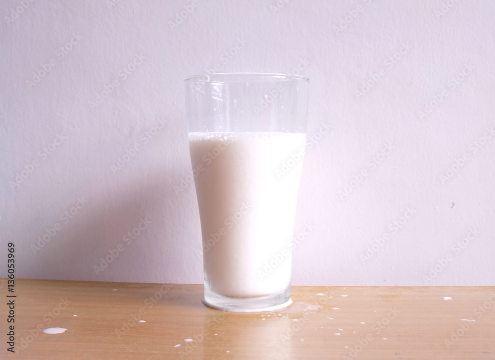 Fresh milk in the glass on table Fresh milk in the glass on table
