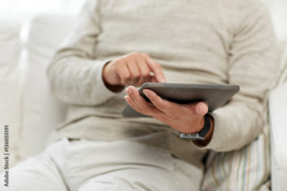 close up of senior man with tablet pc at home close up of senior man with tablet pc at home