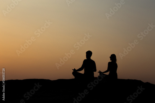 silhouette of couple at sunset summer, healthy concept