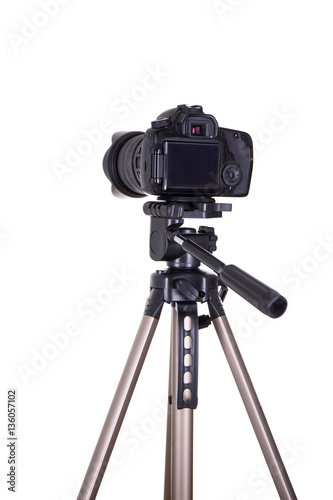 Fotografie modern dslr camera with blank screen on tripod isolated on white