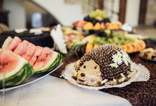 The buffet table with cakes and fruits photo