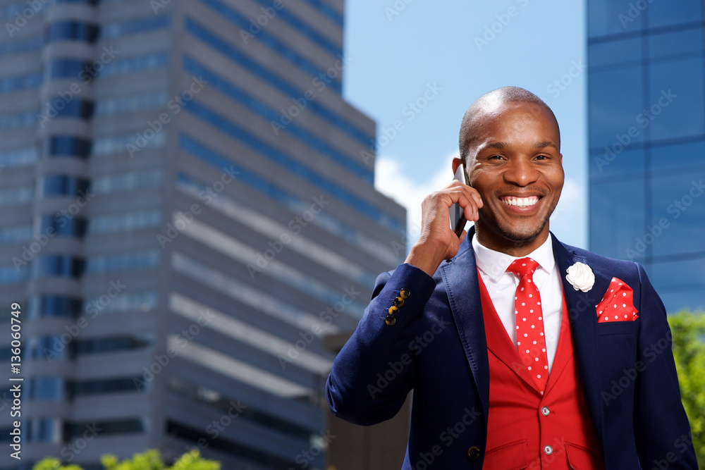 stylish young man in suit using mobile phone outdoors in city stylish young man in suit using mobile phone outdoors in city