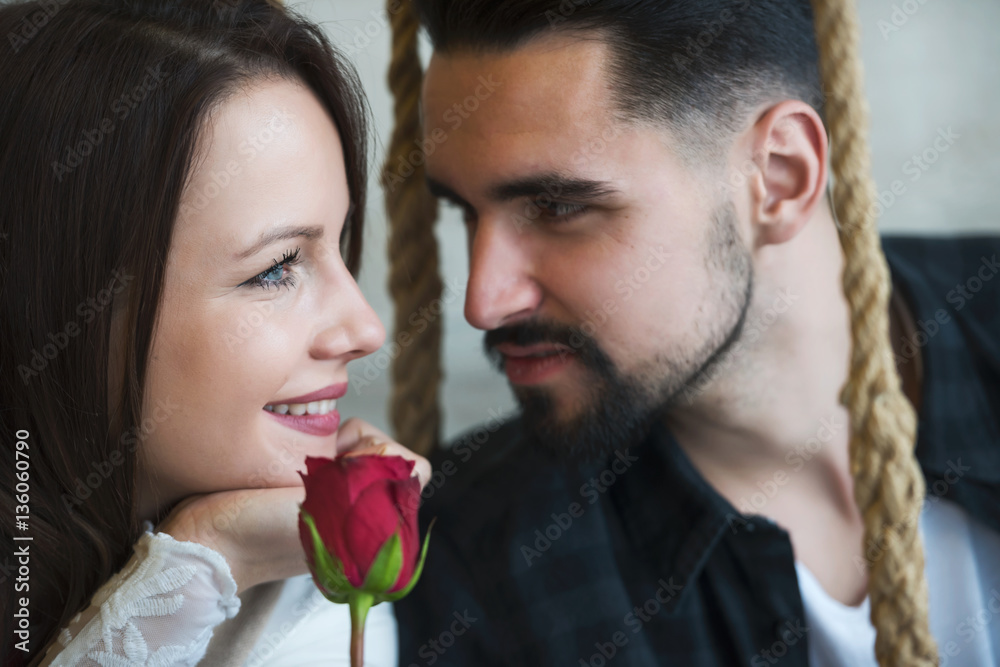 Smiling Young Love Couple with Red Rose