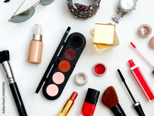 cosmetics top view on a white table. Workplace, cosmetic bag