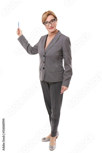 Middle-aged teacher pointing at something isolated on white