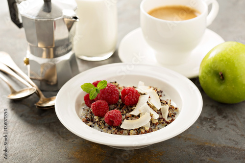 Quinoa porridge with raspberry and coconut flakes