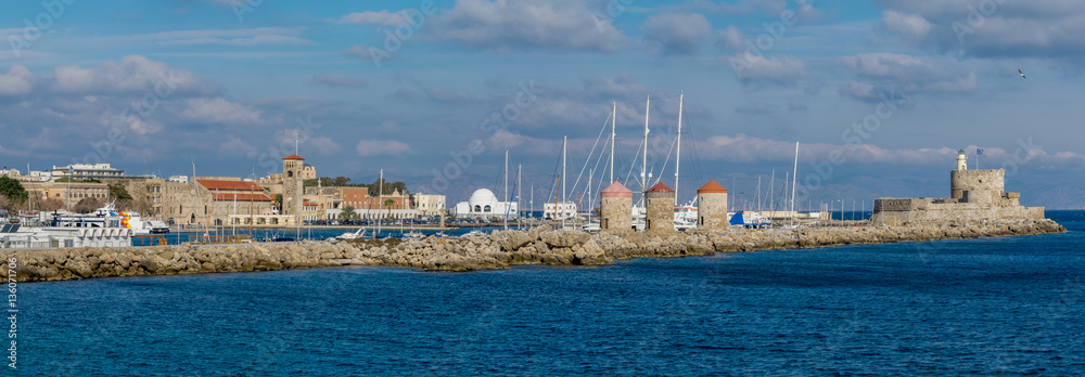 Rhodes waterfront with windmills, castle and lighthouse