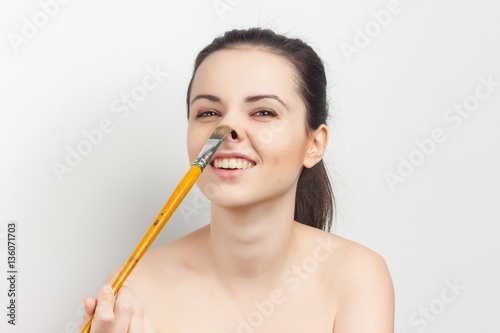 happy woman with big brush in hand