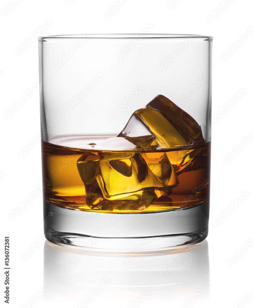 Round transparent glass of whiskey with ice