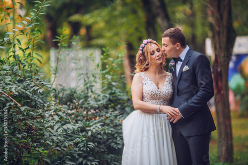 Bride and Groom walking away from the camera after their wedding. Cuouple dancing and swirl