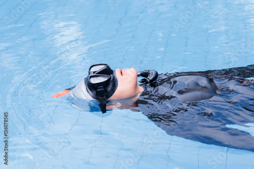 Free diving training on swimming pool