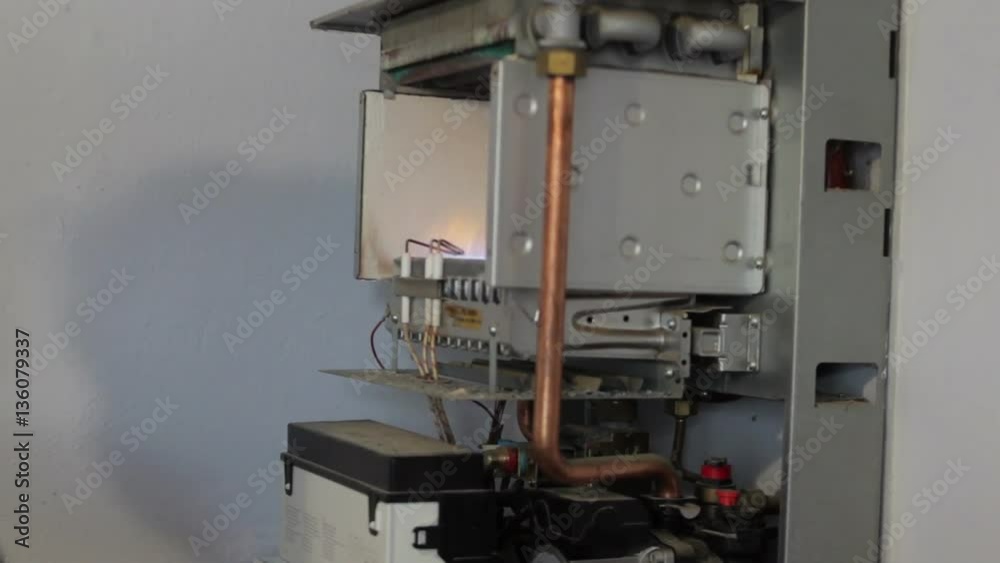 heating boiler repairs/burning fire in heating boiler on the wall heating boiler repairs/burning fire in heating boiler on the wall