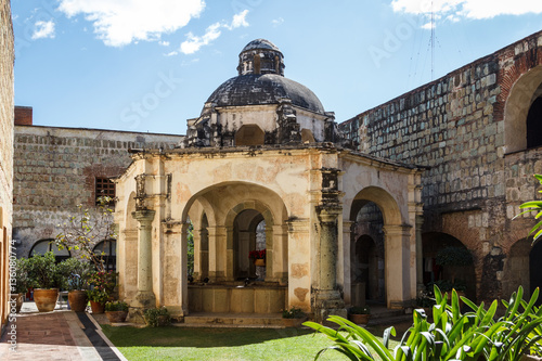 Photography Old fountain in the historic colonial part of Oaxaca town, Mexic