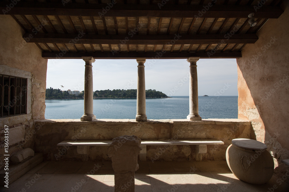 Overlooking the Istrian bay of Porec, also known as Parenzo, in Croatia, from an ancient alcove