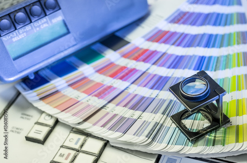 Color management in printing process with magnifying glass, colo photo
