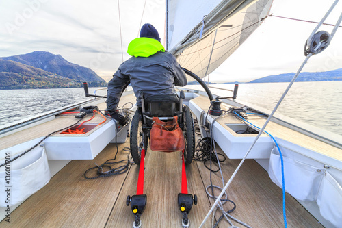 Obraz na płótnie disabled man with wheelchair on sailing boat w salonie