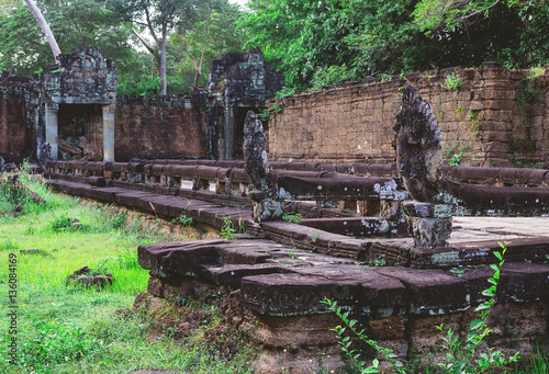 Tower, huge trees and galleries in Preah Khan Temple