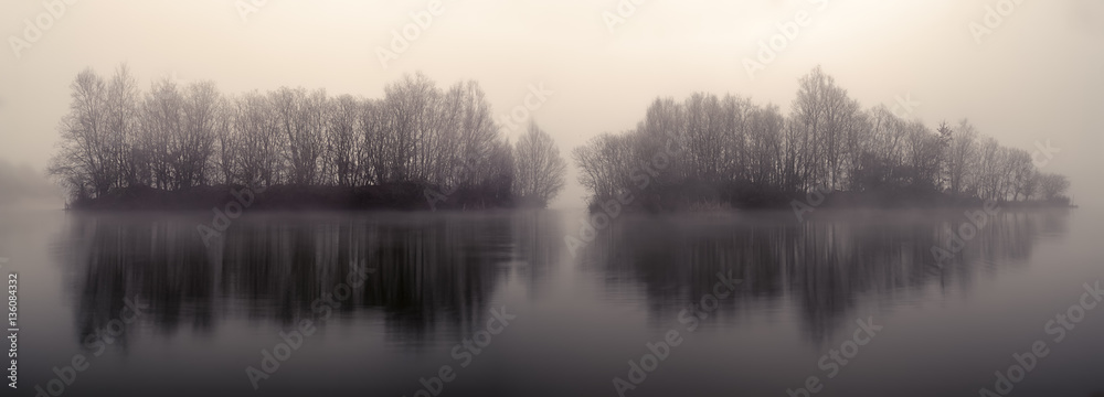 wooded islets in a lagoon at dawn wooded islets in a lagoon at dawn