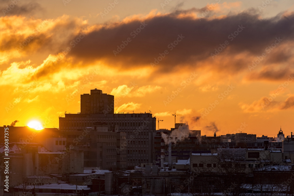 Sunrise over a big city, colorful sky, sun, building. High resolution picture