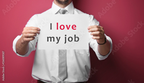 Man holding paper with text...