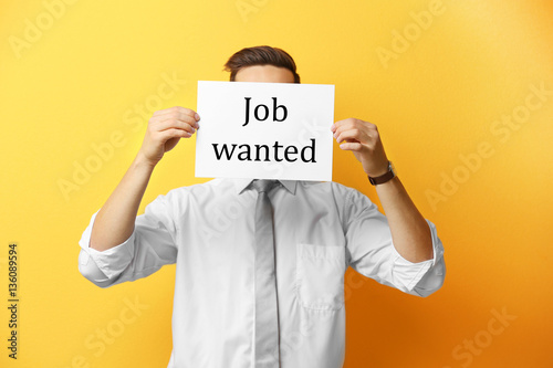 Man holding paper with text...