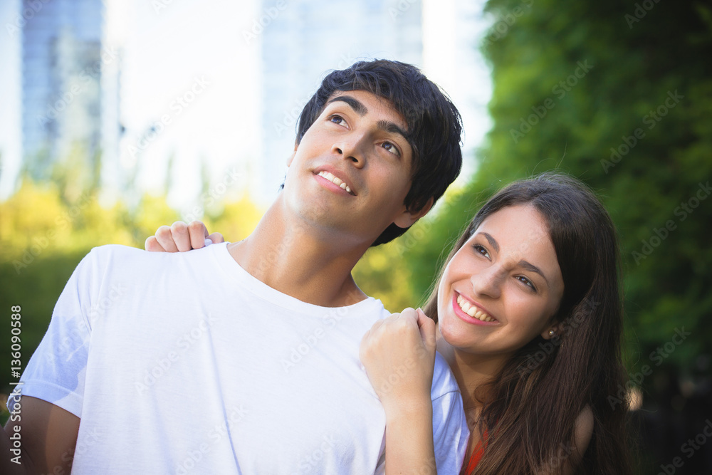 portrait of happy Hispanic couple in the park