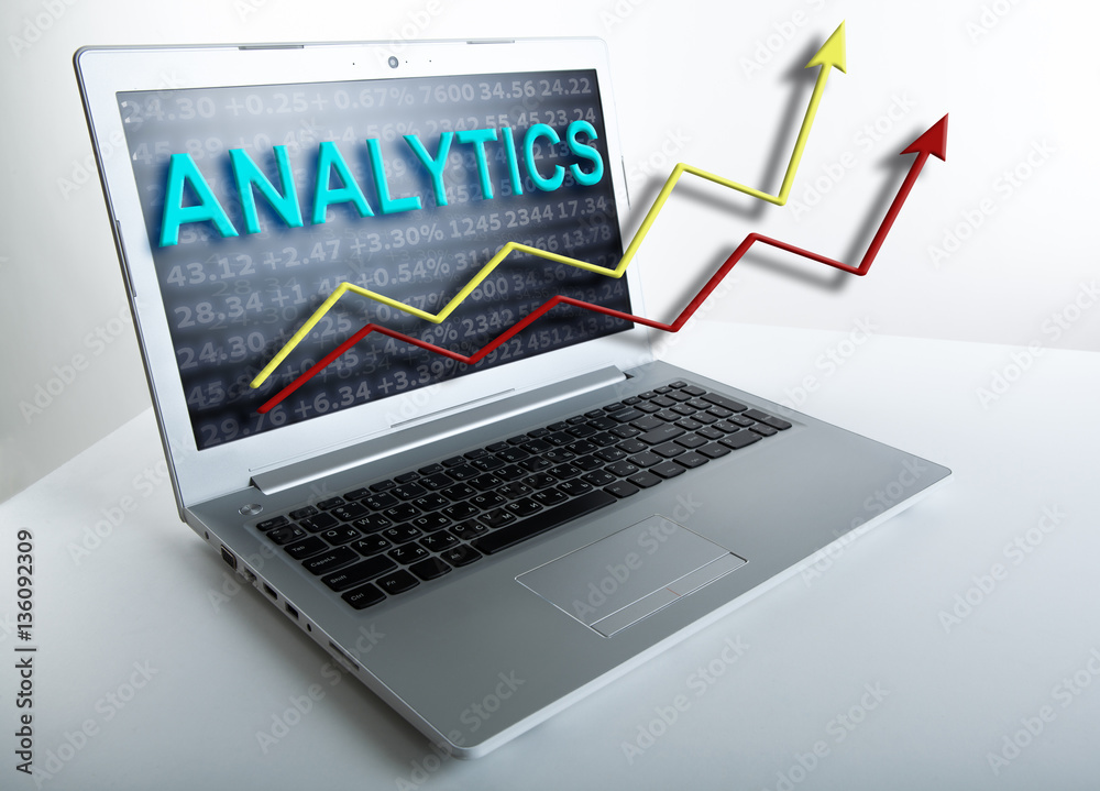 working at a laptop analytics forecasting calculations working at a laptop analytics forecasting calculations
