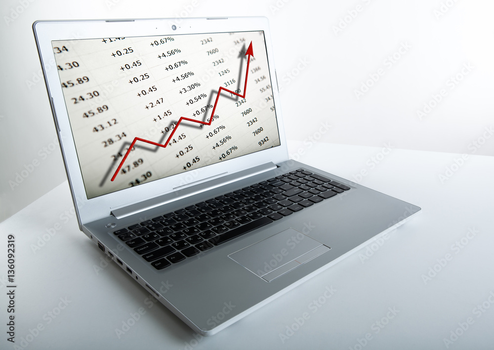 working at a laptop analytics forecasting calculations