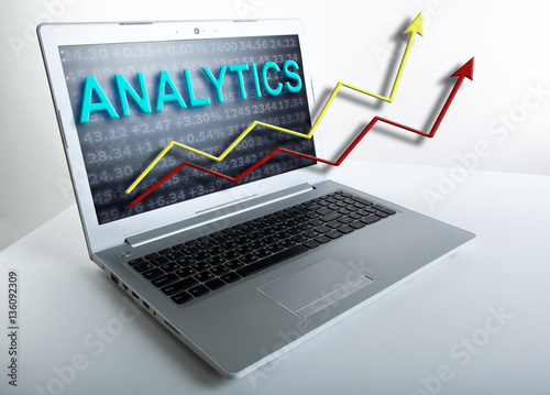 working at a laptop analytics forecasting calculations © mizar_21984