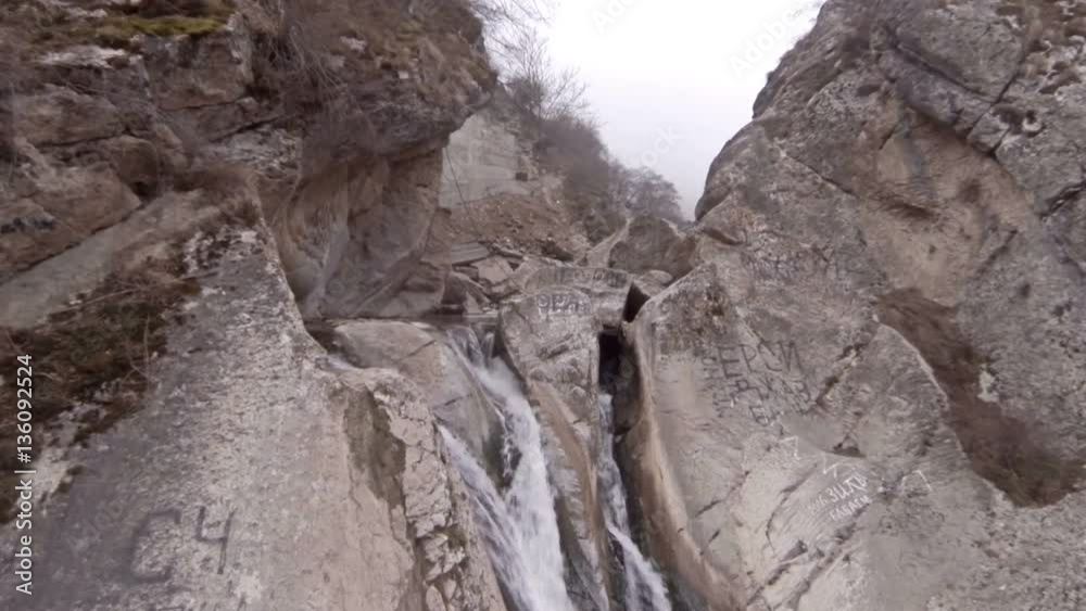 Waterfall in mountains. Panorama slide view. Winter aerial video. Waterfall in mountains. Panorama slide view. Winter aerial video.