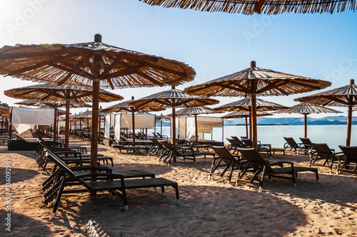 Sun loungers and parasols on the sandy beach