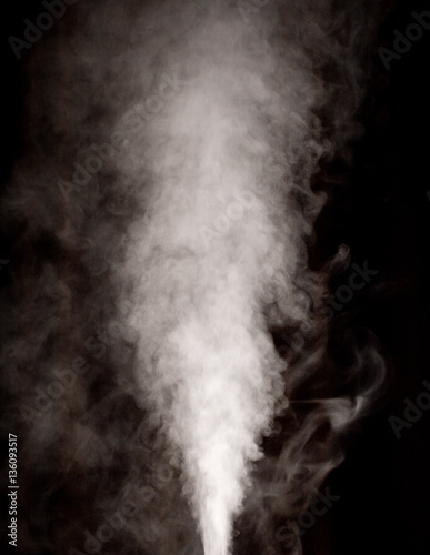 White vapor on the black background