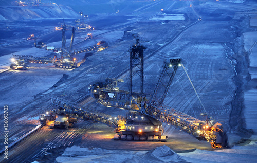 Large bucket wheel excavators in a lignite (brown-coal) mine after sunset, Germany