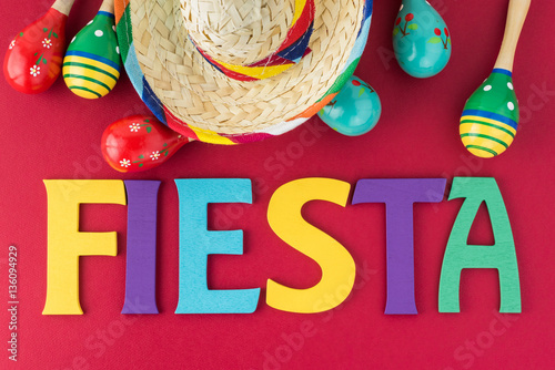 Mexican fiesta table decoration with  colorful painted letters, maracas