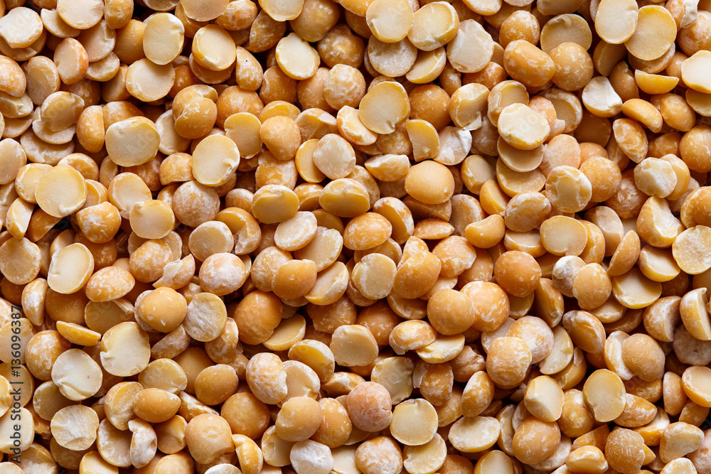 Background of yellow dried split peas from above. Background of yellow dried split peas from above.