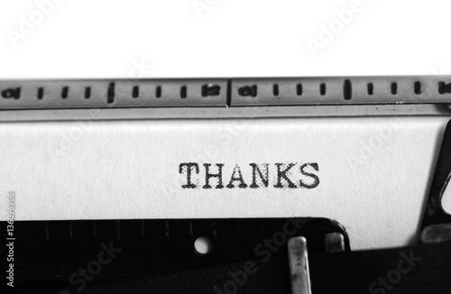 Typewriter. Typing text: thanks