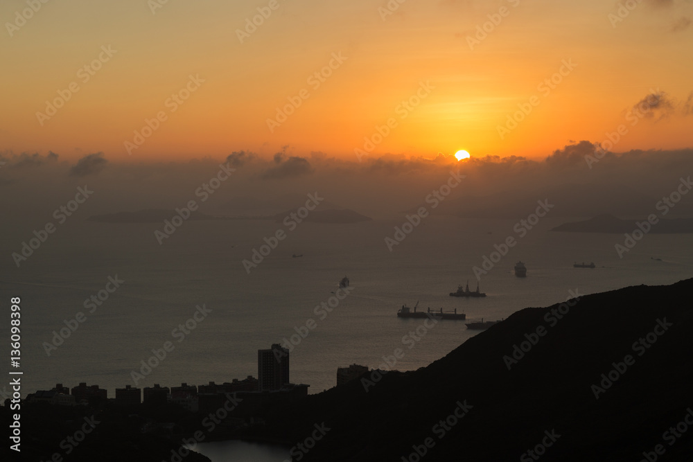 Naklejka premium Ocean, islands, ships, coastline and sunset in Hong Kong, China, viewed from the Victoria Peak. Copy space.