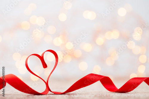 Red heart of ribbon. Valentines day background.