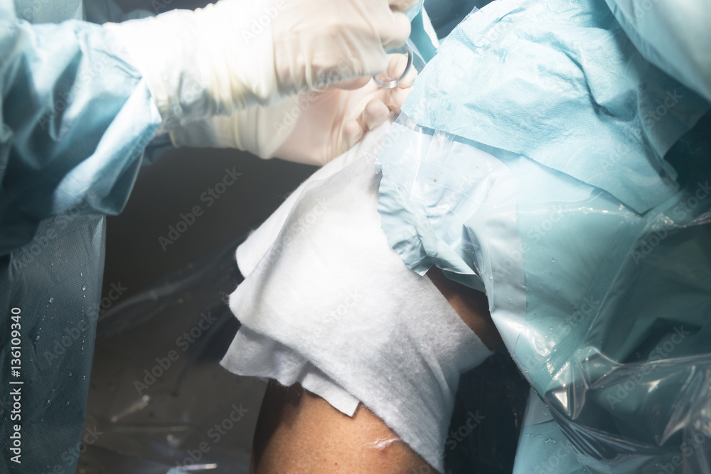 Fototapeta premium Knee surgery nurse bandaging