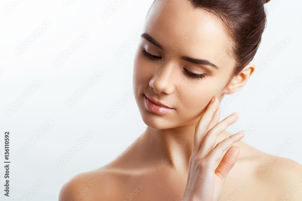 Beautiful Young Woman with Clean Fresh Skin touch own face. Cosmetology, beauty and spa. Beautiful Young Woman with Clean Fresh Skin touch own face. Cosmetology, beauty and spa.