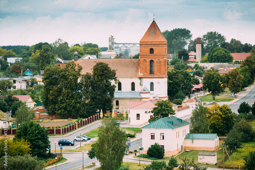 Mir, Belarus. Landscape Of Village Houses And Saint Nicolas Roman Catholic Church In Mir, Belarus. Famous Landmark.