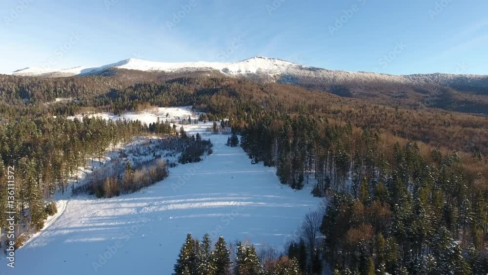 Mountain Pikuy Ukraine winter snow landscape. aerial view fly over. sunset dusk. snow mountains. tourism resort nature Mountain Pikuy Ukraine winter snow landscape. aerial view fly over. sunset dusk. snow mountains. tourism resort nature