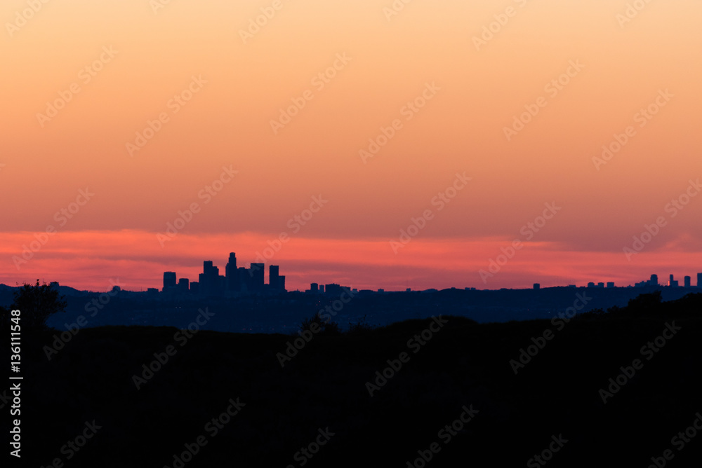Sunset over downtown silhouette of Los Angeles.
