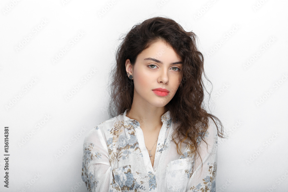 Beauty portrait of young adorable fresh looking brunette woman with long brown healthy curly hair. Emotion and facial expression lifestyle concept. Beauty portrait of young adorable fresh looking brunette woman with long brown healthy curly hair. Emotion and facial expression lifestyle concept.
