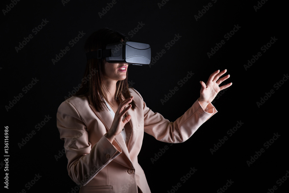 Fototapeta premium Businesswoman playing virtual reality simulation
